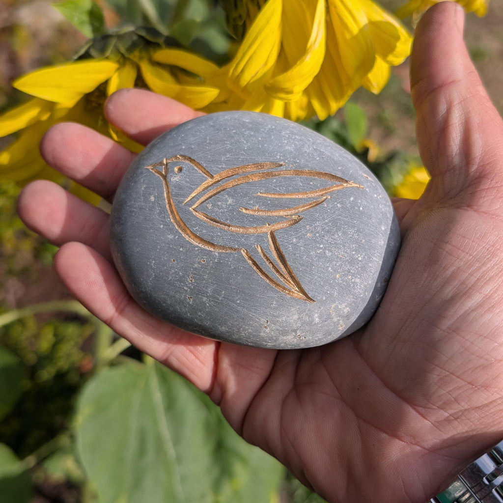 Hand Carved Stone Bird: Engraved Pebble Art with Gold Inlay