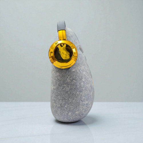 DJ OoF Limestone Sculpture: Hand-Carved Stone Decor with Green Headphones